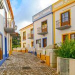 Village street with residential buildings in the town of Bordeira near Carrapateira, Municipality of Aljezur, District of Faro, Algarve Portugal