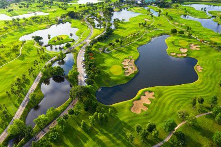 Golf course beautiful Aerial view of golf field landscape with sunrise view in the morning shot. Bangkok Thailand