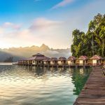 Panorama of Traditional Thai bungalows at Cheow Lan lake, Ratchaprapha Dam, Khao Sok National Park in Thailand in a summer day