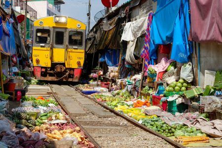 Thailand, Bangkok. Maeklong railroad tracks market (Train Market)