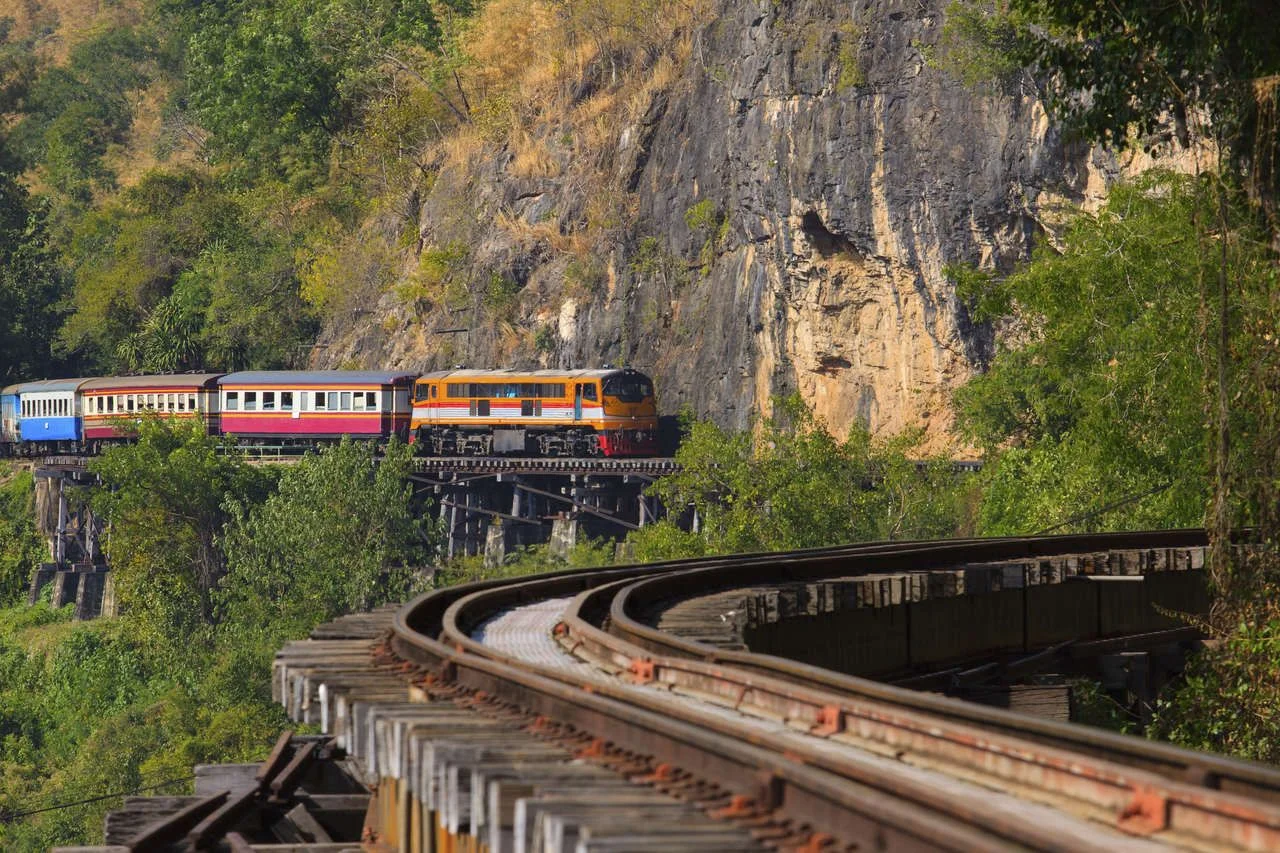 Trains running on death railways crossing kwai river in kanchanaburi border of thailand-myanmar important landmark and destination to visiting and world