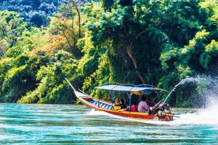 View on boat on Mae Nam Kok river by Chiang Rai – Thailand