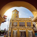 Restored chino-Portuguese clock tower in phuket old town, Thailand