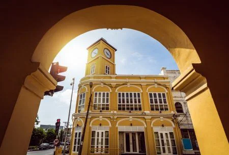 Restored chino-Portuguese clock tower in phuket old town, Thailand