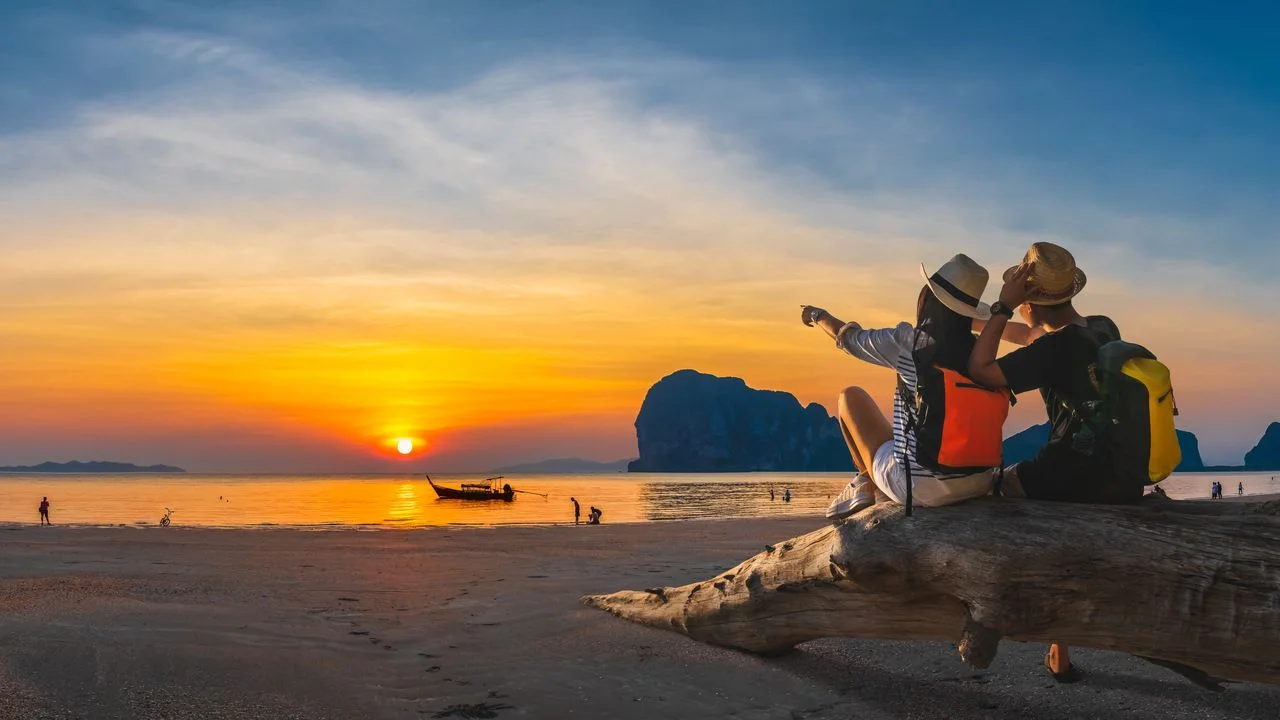 Romantic couple traveler joy look beautiful nature at sunset Pak Meng beach Outdoor lifestyle attraction travel Trang Thailand exotic beach