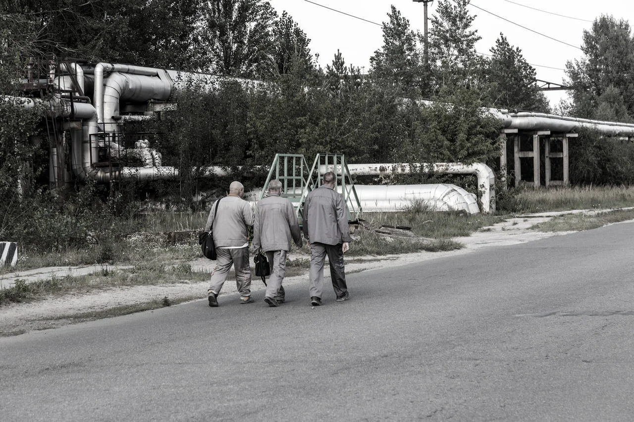Workers go to Reactor 4 at the Chernobyl nuclear power plant with a new confinement. Global atomic disaster. Chernobyl Exclusion Zone