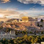 Acropolis of Athens, Greece, with the Parthenon Temple atop the hill during the summer sunset