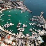 Aerial drone bird’s eye view photo of iconic round shaped picturesque port of Mikrolimano with sail boats and yachts docked and beautiful colours, Piraeus port, Attica, Greece