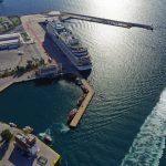 Aerial drone photo of famous and busy port of Piraeus where passenger ferries travel to Aegean destination islands as seen from high altitude , Attica, Greece
