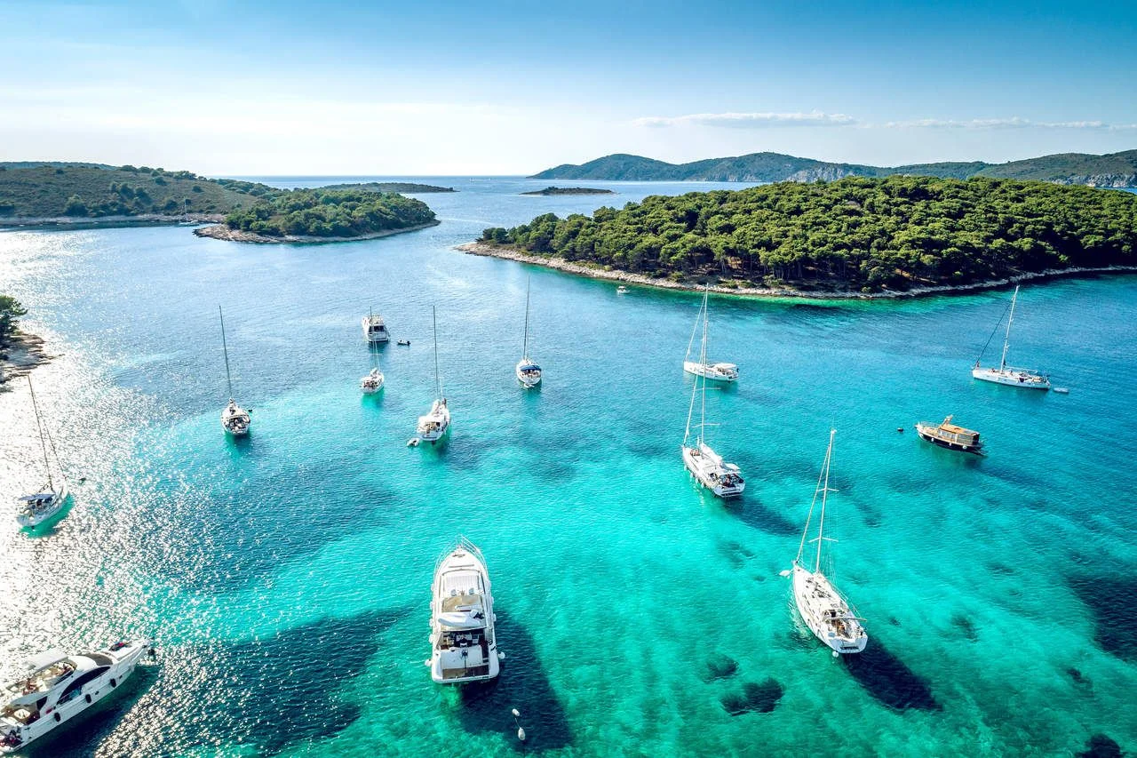 Aerial view of Paklinski Islands in Hvar, Croatia. Turquoise water bays with luxury yachts and sailing boats. Toned image. (2)