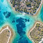 Ariel view of popular Blue Lagoon – Krknjasi near town Trogir, in the Adriatic sea, Croatia