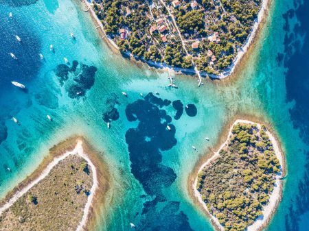 Ariel view of popular Blue Lagoon – Krknjasi near town Trogir, in the Adriatic sea, Croatia
