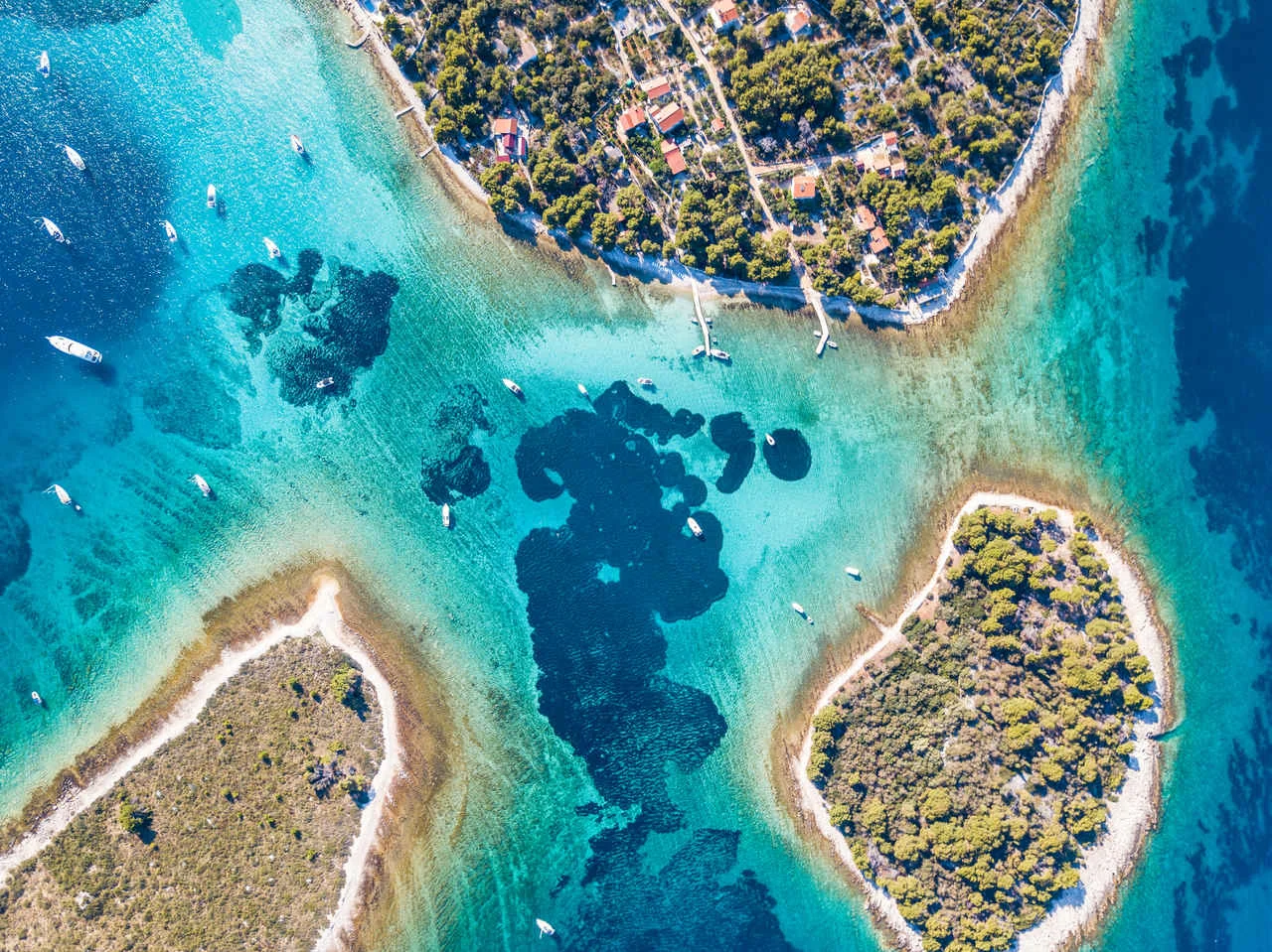 Ariel view of popular Blue Lagoon – Krknjasi near town Trogir, in the Adriatic sea, Croatia