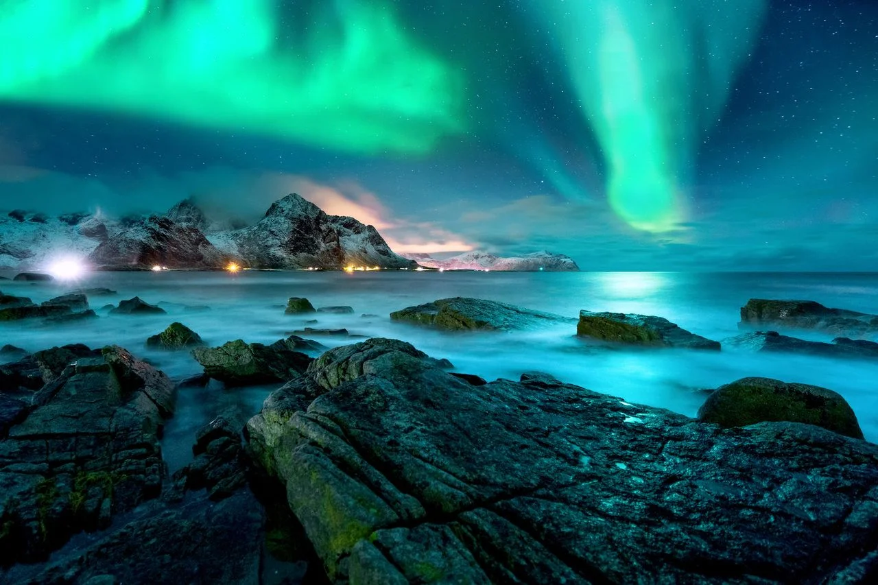 Aurora borealis over the snowy islands of Lofoten