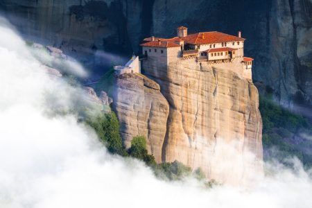 Beautiful misty layers of mountains near Meteora in Greece in sunlight. Greece