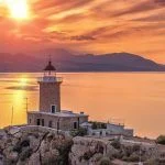 .Beautiful sunset in the lighthouse in Melagavi cape at Loutraki, Greece.