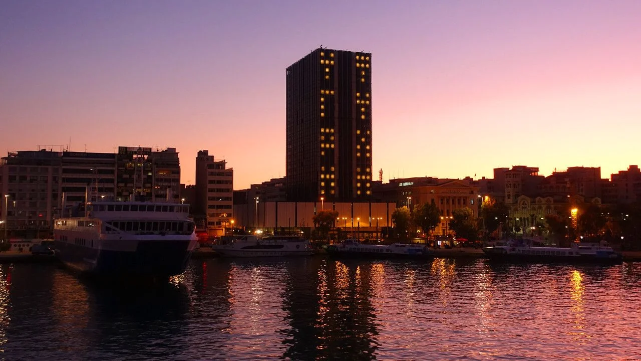 Busy port of Piraeus at dawn with beautiful sky colours, Attica, Greece