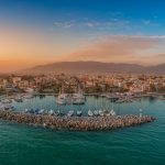 Idyllic landscape flying above Kalamata’s Marina at sunset. Aerial photography of Kalamata city, Messenia, Peloponnese, Greece
