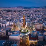 Omonia square aerial view at night time, Athens city center view from the sky. Aerial drone view of night Athens, Greece