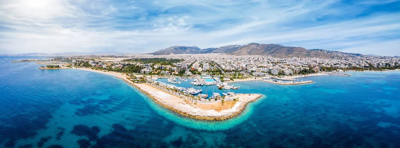Panoramic aerial view to the coastline of Glyfada district, south Athens, Greece, with yacht marinas, beaches and turquoise sea