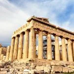 Parthenon temple in sunny day. Acropolis in Athens, Greece. The Parthenon is a temple on the Athenian Acropolis in Greece, dedicated to the goddess Athena.