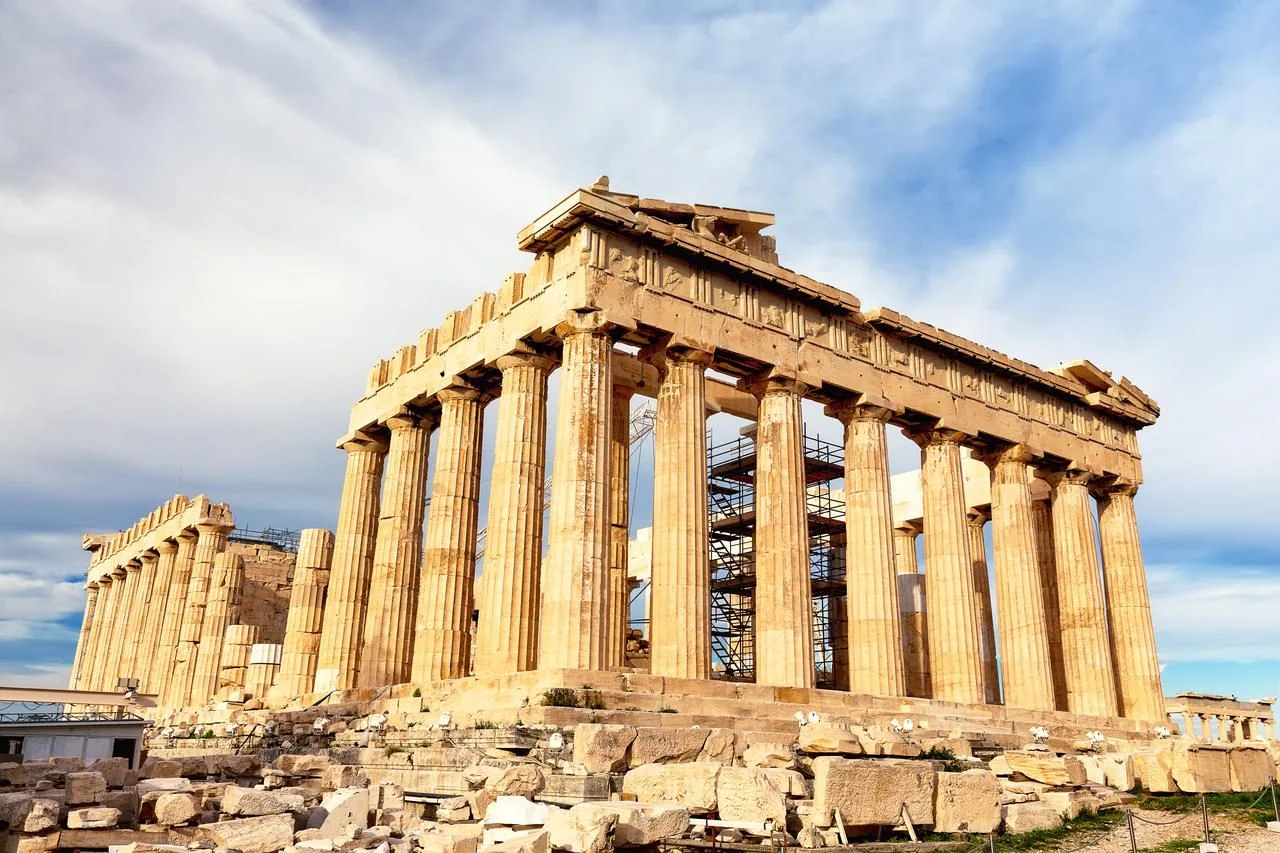 Parthenon temple in sunny day. Acropolis in Athens, Greece. The Parthenon is a temple on the Athenian Acropolis in Greece, dedicated to the goddess Athena.