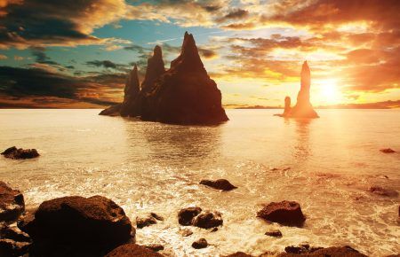 Reynisdrangar rock formations near Vik at sunset, Iceland