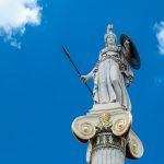Statue of the goddess Athina, goddess of a piece, wisdom and culture, daughter of Zeus and protector of the city of Athens, Greece. The statue is located right in front of the Academy of Athena.