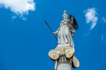 Statue of the goddess Athina, goddess of a piece, wisdom and culture, daughter of Zeus and protector of the city of Athens, Greece. The statue is located right in front of the Academy of Athena.