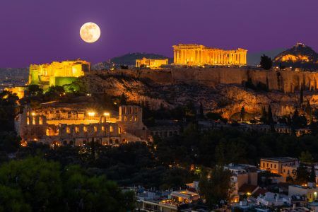 Sunset view on Acropolis in Athens, Greece at with full moon. Travel in Greece