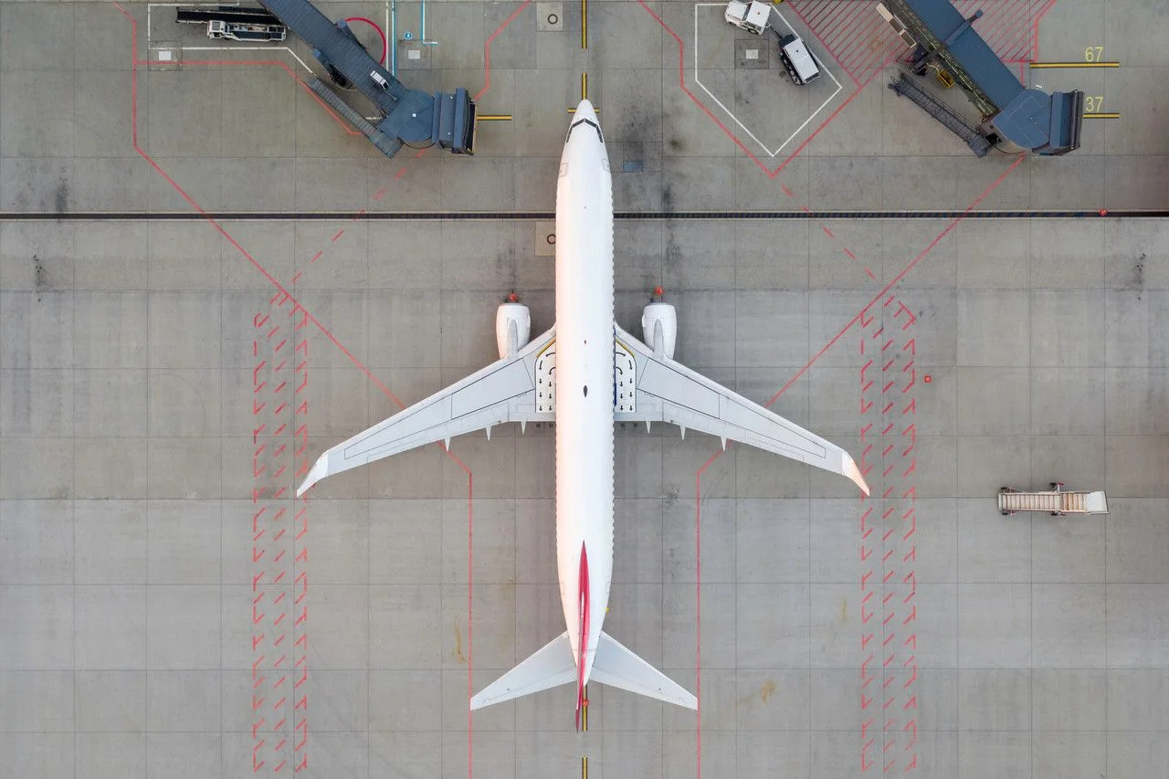 Top down view on airplane airplane airplane airplane in terminal in airport apron parking lot waiting for service maintenance, refilling fuel services after airspace blocked. Modern airplane plane (2)
