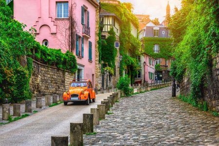 View of an old street in Montmartre in Paris, France. The cozy landscape of Paris. Architecture and monuments of Paris.