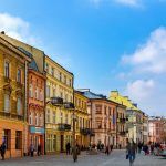 View of traditional colored tenements houses on central streets of Polish city of Lublin in sunny spring day