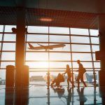 people at the airport, silhouette of a young family with a child traveling by plane, vacation