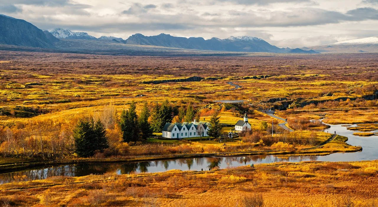 plain thingvellir national park in reykjavik enters to the iceland golden circle. countryside with river, church, houses on mountain landscape in Iceland. best vacations. perfect morning