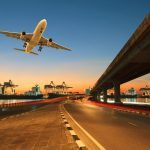 road land bridge leading to ship port and commercial cargo plane flying over use for land, aviation and ship industries