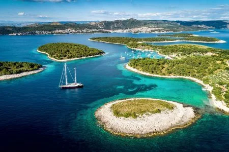 Aerial view of Paklinski Islands in Hvar, Croatia. Turquoise water bays with luxury yachts and sailing boats. Toned image.