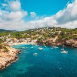 Aerial view of the cliffs and the beach of Cala Vadella, Ibiza, Spain.beach where summer families with children