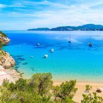 Amazing beach view with azure sea water in Cala San Vicente bay in northern part of Ibiza island, Spain