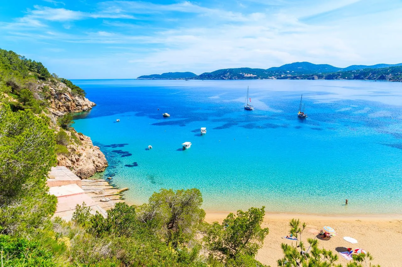 Amazing beach view with azure sea water in Cala San Vicente bay in northern part of Ibiza island, Spain