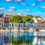Idyllic fisherman port with colorful houses at Porto Colom, Spain Majorca, Balearic Islands.