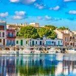 Idyllic fisherman port with colorful houses at Porto Colom, Spain Majorca, Balearic Islands.