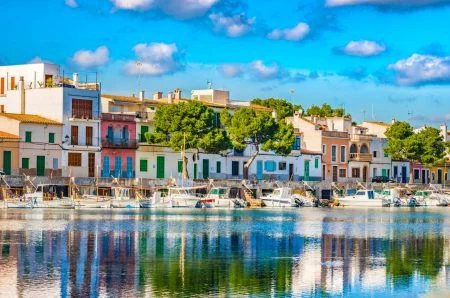 Idyllic fisherman port with colorful houses at Porto Colom, Spain Majorca, Balearic Islands.