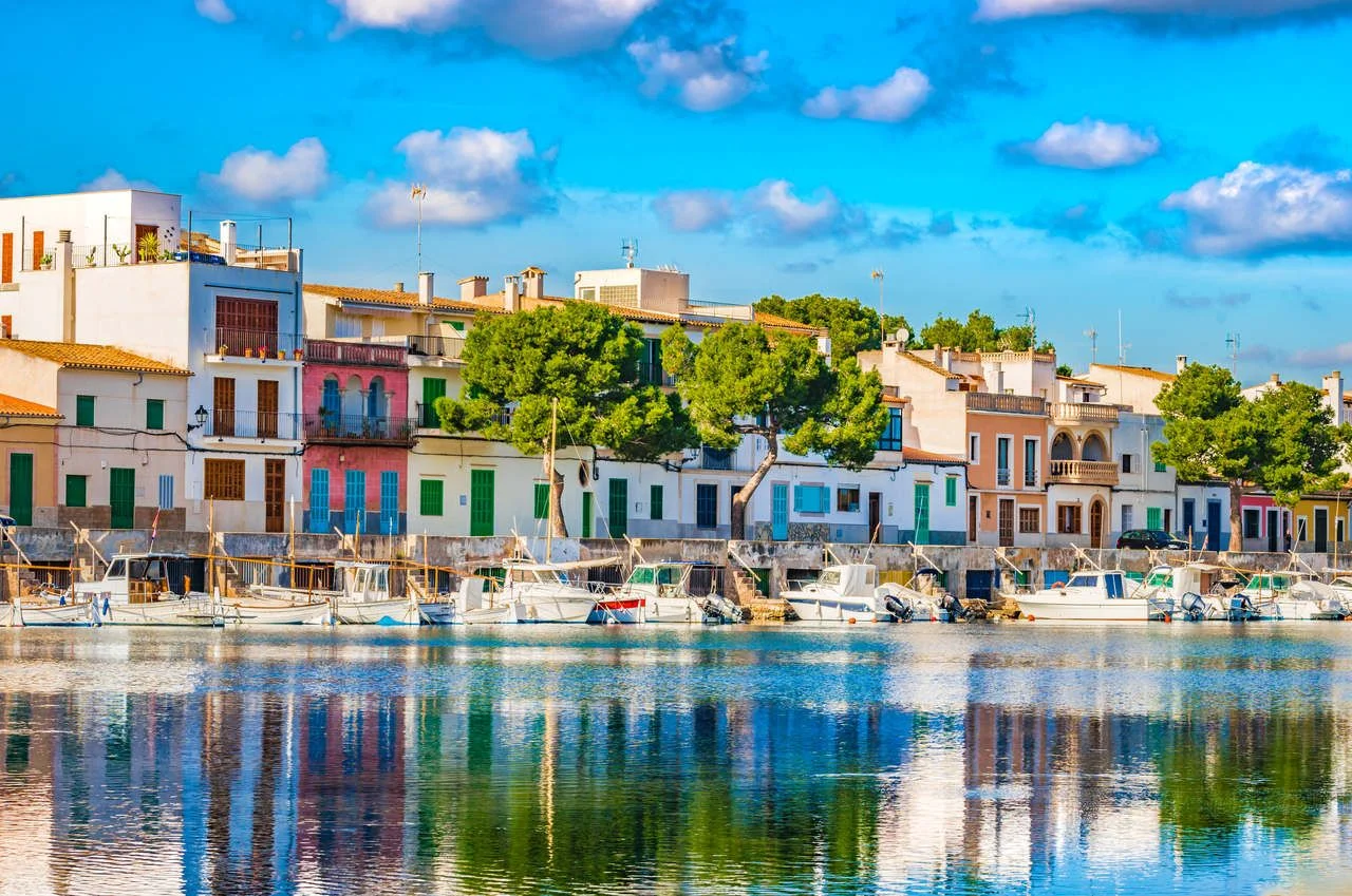 Idyllic fisherman port with colorful houses at Porto Colom, Spain Majorca, Balearic Islands.
