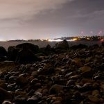 Long exposure panorama over the sea and beach of Margine rosso, Poetto, near Cagliari, Italy at night