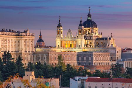 Madrid. Image of the Madrid skyline with the Cathedral of Santa Maria la Real de La Almudena and the Royal Palace at sunset.