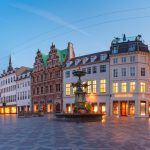 Panorama of Amagertorv square, Stroget street during morning blue hour, Copenhagen, capital of Denmark