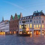 Panorama of Amagertorv square, Stroget street during morning blue hour, Copenhagen, capital of Denmark
