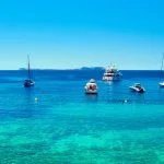 Panorama of sailboats at Cala Salada lagoon. Idyllic scenery. Ibiza, Balearic Islands. Spain