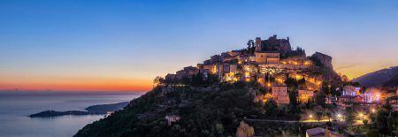 Panoramic view of medieval hilltop village Eze at dusk, Alpes-Maritimes, France